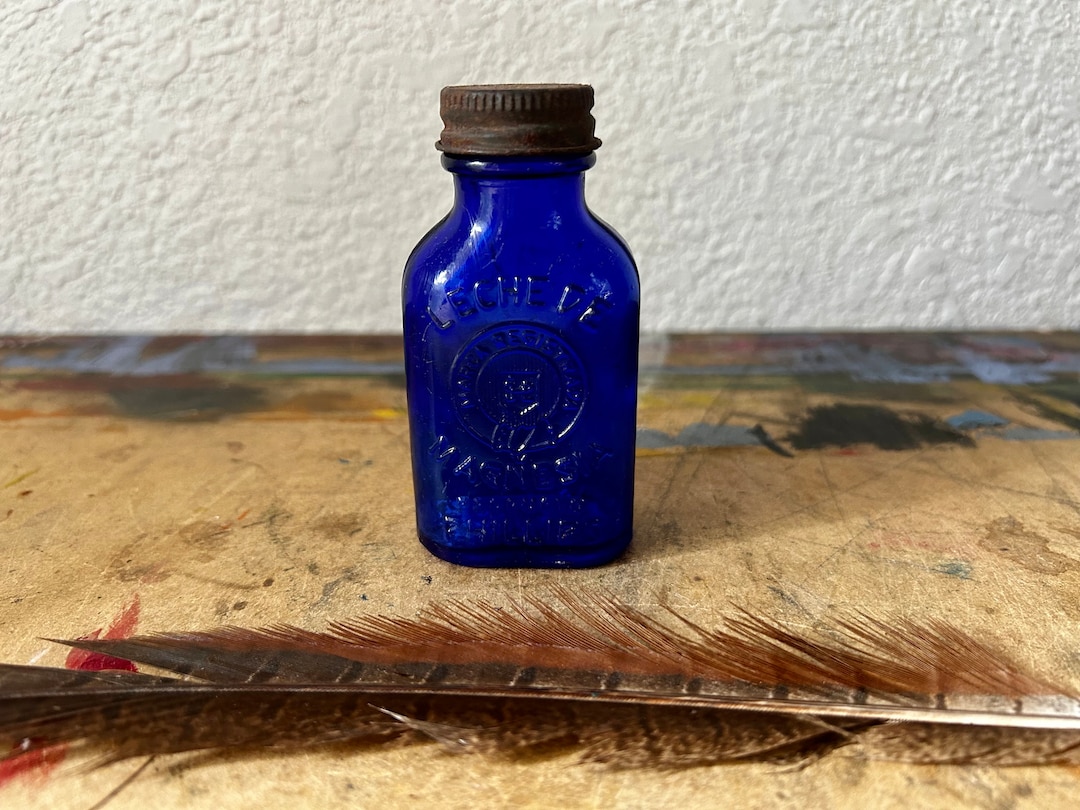 Vintage 1940s Phillips Milk of Magnesia Spanish Embossed Cobalt Bottle