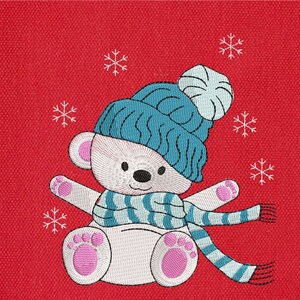May include: A white polar bear wearing a blue and white knit hat and a blue and white striped scarf. The bear is sitting on a red background with white snowflakes.