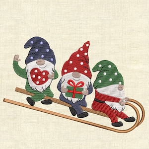 Motifs de broderie machine trois gnomes sur un traîneau
