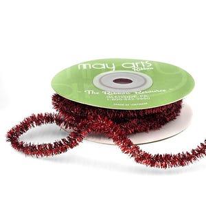 May include: A spool of red tinsel ribbon with a white label that reads "May Arts Ribbon - The Ribbon Resource - Glenside, PA 1-800-442-3950 - Made in Vietnam."