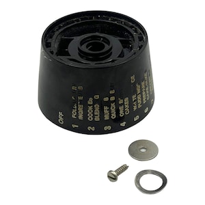 May include: Black plastic kitchen appliance knob with gold lettering. The knob has a dial with settings for "OFF", "FOLDING URY", "INGRETTEN 8", "COOK ED", "BLENDING", "MUFF 8", "QUICK BED", "ONE BOWL", "CAKES", "WHTE SAUCE", "PUDD NGO", "PREPARE", "CAKE M.XE".