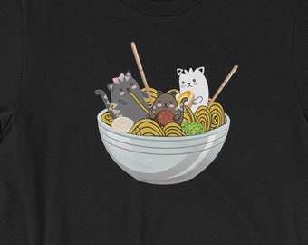 May include: Black t-shirt with a graphic of three cats eating ramen noodles from a bowl.