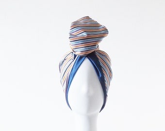 Moldable turban band for cotton hair with multicolor stripe pattern on light background
