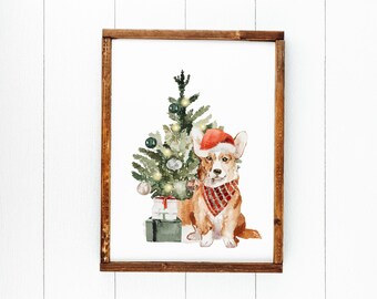May include: A watercolor painting of a corgi wearing a red Santa hat and a red and black plaid bandana sitting next to a small Christmas tree with lights and ornaments. The tree is in a pot with a green and white gift box in front of it.
