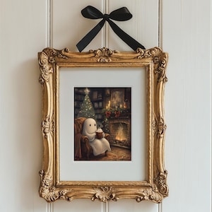 May include: A framed illustration of a ghost sitting in a chair by a fireplace with a mug in its hands. The ghost is white and has a simple face. The fireplace is lit and there is a Christmas tree in the background.