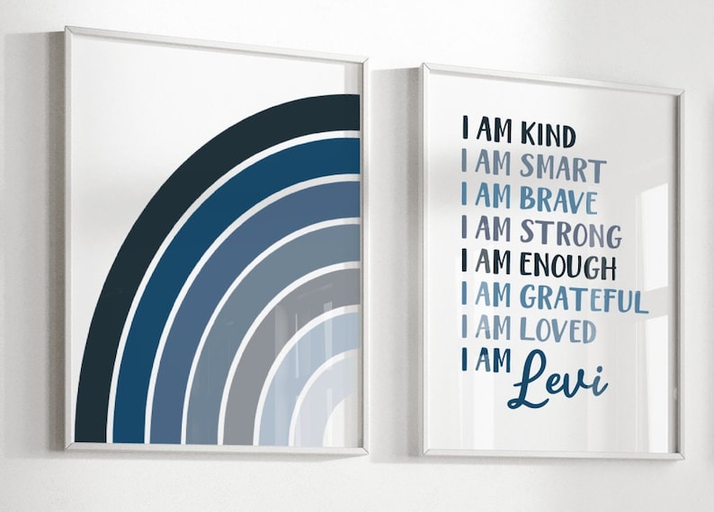 May include: Two framed prints in a blue and white colour scheme. The left print features a blue ombre rainbow arc. The right print features the text "I am kind, I am smart, I am brave, I am strong, I am enough, I am grateful, I am loved, I am Levi".