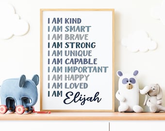 May include: A framed print with a blue and gray gradient design. The print features the text "I am kind, I am smart, I am brave, I am strong, I am unique, I am capable, I am important, I am happy, I am loved, I am Elijah".