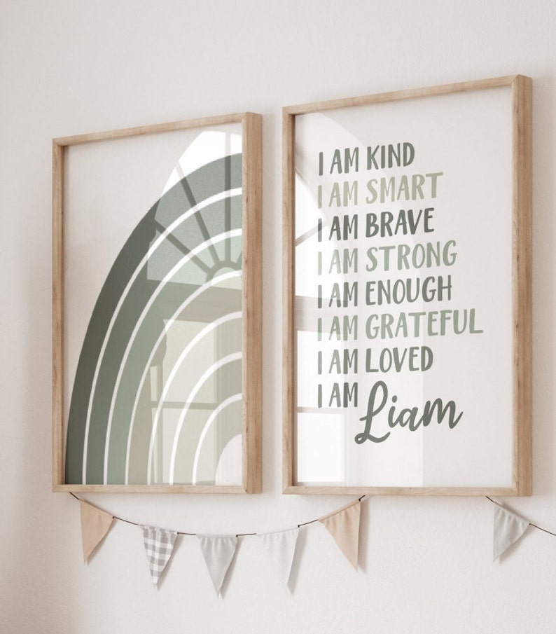 May include: Two framed prints with a green and white rainbow design on the left and a list of positive affirmations on the right. The affirmations include "I am kind", "I am smart", "I am brave", "I am strong", "I am enough", "I am grateful", "I am loved", and "I am Liam".
