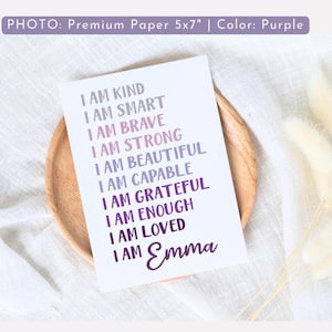 May include: Purple and white printable 5x7 inch card with the text "I am kind, I am smart, I am brave, I am strong, I am beautiful, I am capable, I am grateful, I am enough, I am loved, I am Emma".