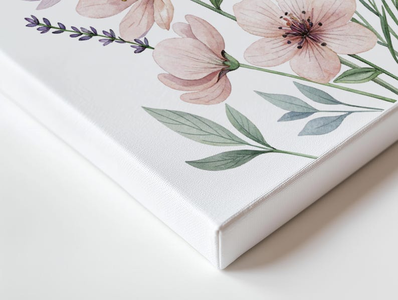 May include: A canvas art print featuring a watercolor floral design. The artwork showcases delicate pink flowers, lavender sprigs, and green leaves against a white background. The canvas has a clean, white edge, creating a modern aesthetic.