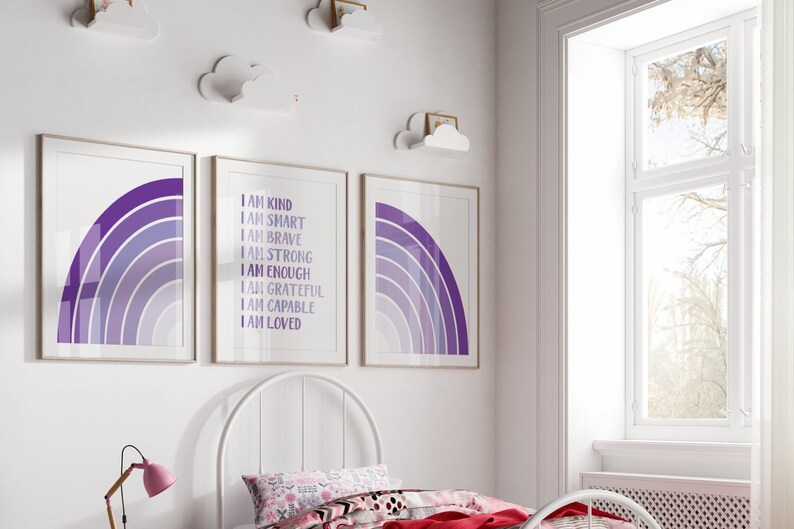 May include: Three framed prints with purple and white rainbow designs. The center print has the text "I am kind, I am smart, I am brave, I am strong, I am enough, I am grateful, I am capable, I am loved".