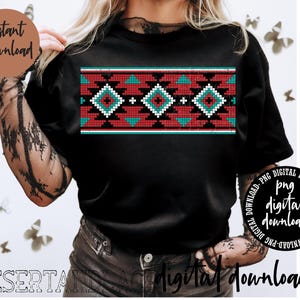 May include: A black t-shirt featuring a red, white and turquoise geometric pattern across the chest. The pattern is reminiscent of Native American designs.