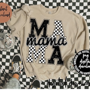 May include: A beige sweatshirt with a black and white checkered design that says "MA mama MA".