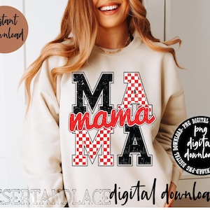 May include: A white sweatshirt with a black and red graphic design that says "MA mama". The graphic design features a checkered pattern.