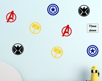 May include: A wall with nine superhero themed decals, including Captain America's shield, Thor's hammer, and the Avengers logo. The decals are 70mm in size and are shown on a light blue wall.