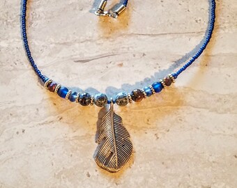 BLD Peg Montana blue glass and stone single strand beaded necklace with silver feather pendant