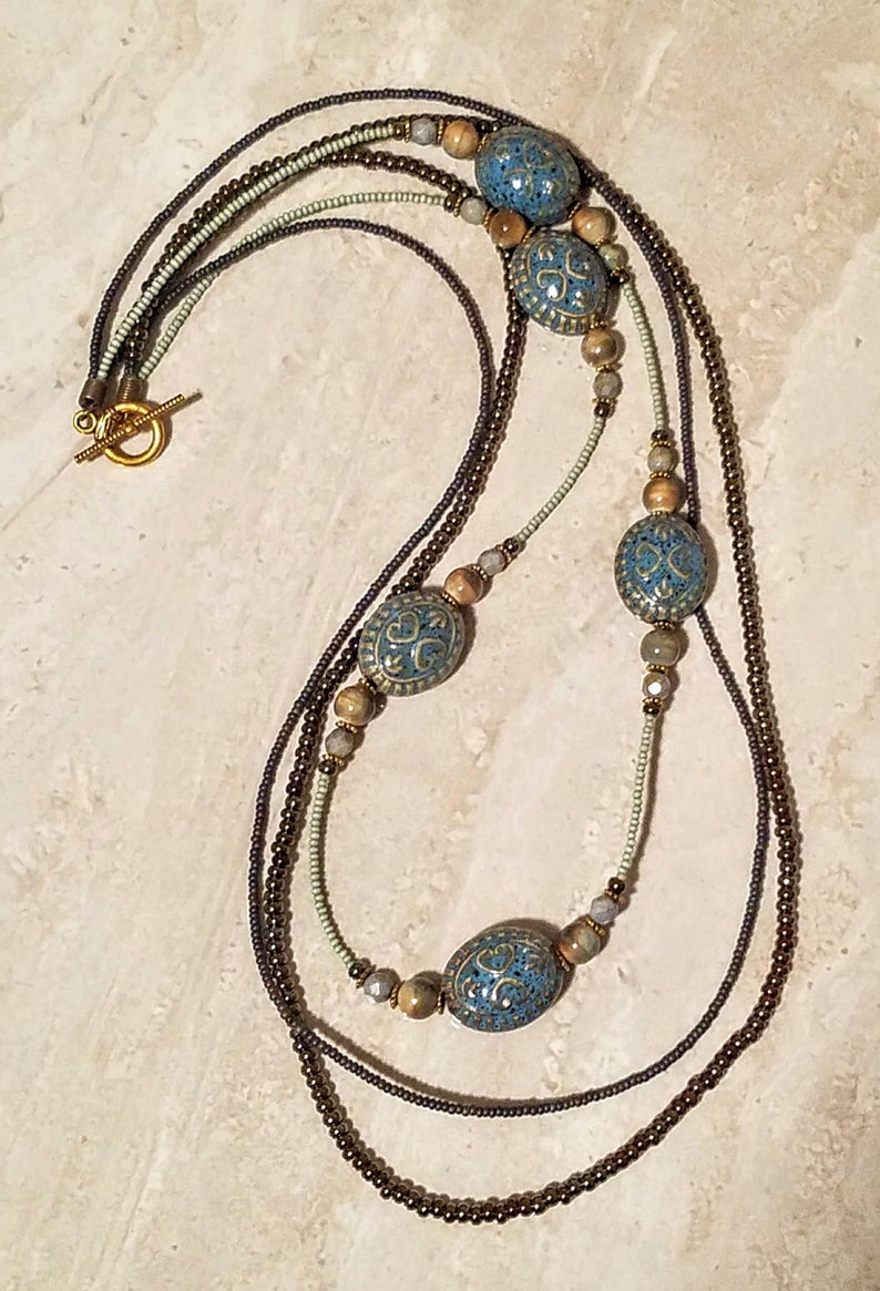 L3S Peg Montana Long 3 Strand Blue and Brown Iris Glass necklace