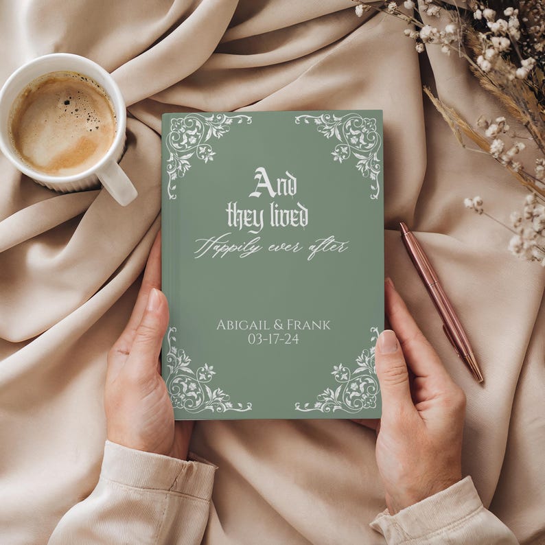 May include: A sage green wedding guest book with the text "And they lived Happily ever after" and the names Abigail & Frank, with the date 03-17-24. The book has decorative white floral corner designs.