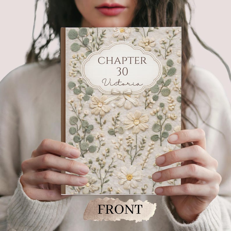 May include: A floral-themed book cover with the text "CHAPTER 30 Victoria" in an ornate frame. The cover is decorated with white and cream-colored flowers and green leaves. The word "FRONT" is at the bottom of the book.