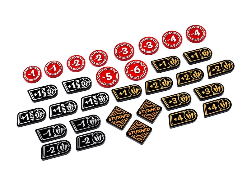 May include: A collection of game tokens in red, black, and gold. The tokens include numbered counters, buff indicators, and "STUNNED" markers. The game pieces are designed for tabletop gaming.