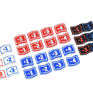 May include: A set of 18 plastic game pieces with different numbers and colors. The pieces are red, white, blue, and black. The numbers on the pieces are +1, +2, +3, +4, -1, -2, -3, and -4.