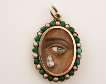 Médaillon ancien en or 9 carats représentant un œil d'amoureux, symbole d'amour interracial, de couleur noire, d'origine indienne ou africaine, peint à la main.