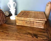 Small vintage suitcase in braided wicker