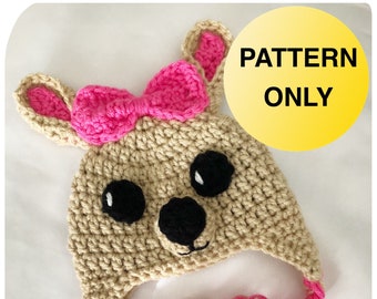 May include: Crochet pattern for a beige and pink bunny hat with a bow. The pattern is called "Little Tickles" and is for sale. PATTERN ONLY.