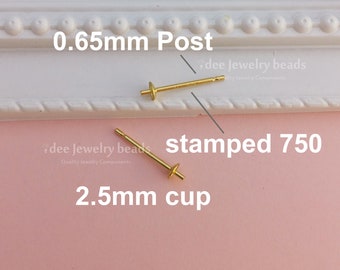 May include: Two gold earring posts with a 0.65 mm post and a 2.5 mm cup. The posts are stamped 750.