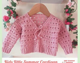 May include: A light pink long-sleeved cardigan made with a crochet stitch pattern featuring a V-neckline and a front tie closure. The garment has ribbed cuffs and a ribbed hem. The text Kids Little Summer Cardigan PDF Crochet Pattern By Baby Crochet Designs is visible at the bottom.