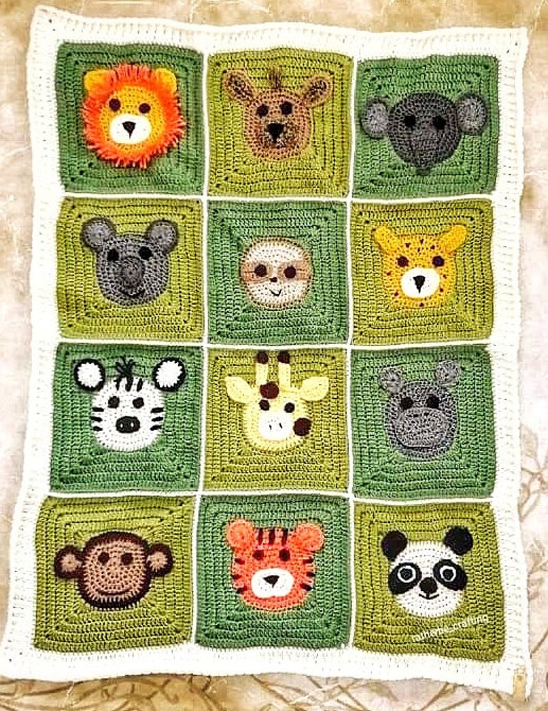 Peut inclure: Une couverture pour b&eacute;b&eacute; en crochet de couleur verte et blanche. La couverture pr&eacute;sente une vari&eacute;t&eacute; de visages d'animaux, dont un lion, une girafe, un z&egrave;bre, un panda, un singe et un tigre.