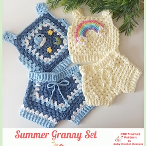 May include: Two sets of handmade crochet clothing featuring a tank top and shorts. One set is dark blue and light blue with a whale and star motif. The other set is cream-coloured with a rainbow and flower applique. Text reads Summer Granny Set.
