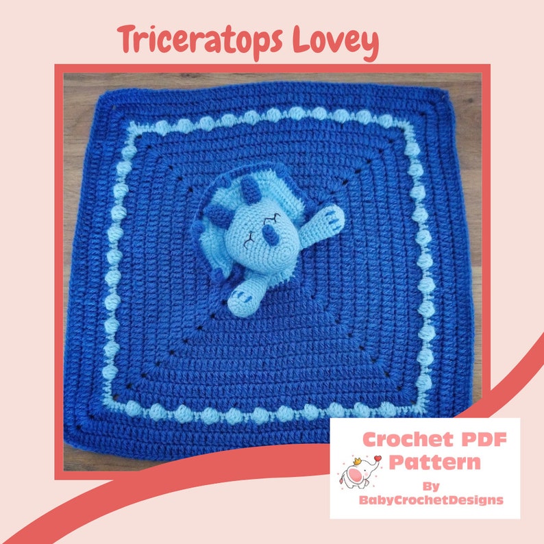 May include: A blue crocheted baby blanket with a light blue crocheted dinosaur in the centre. The blanket has a light blue border with white dots. The text "Crochet PDF Pattern By BabyCrochetDesigns" is in the bottom right corner of the image.