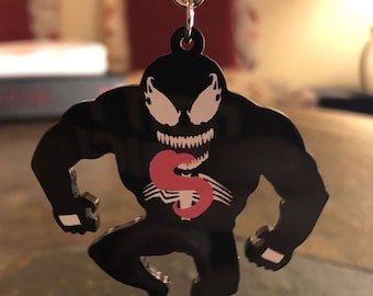 Symbiotic Alien Suit Black Acrylic Charm