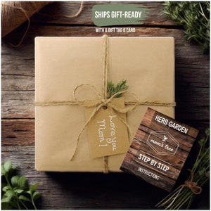 May include: A brown paper package tied with twine and a gift tag that says "Love you Mom!"  The package is sitting on a wooden surface with green herbs. A card with the text "Herb Garden" and "Mom's Tree" is also visible.