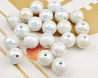 May include: A collection of iridescent white round beads. The beads have a smooth, glossy finish and are perfect for crafting jewelry or other decorative projects.