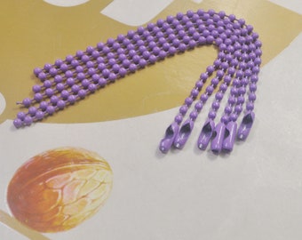 May include: A set of purple beaded chains with metal end caps. The chains are made of small, round beads and are approximately 12 inches long.