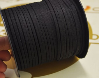 May include: A spool of black suede cord, wound tightly and ready for crafting projects.