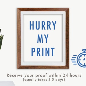 May include: A framed print with the words "HURRY MY PRINT" in blue. The frame is brown with a white border. A blue stopwatch icon is on the right. A potted plant is on the left.