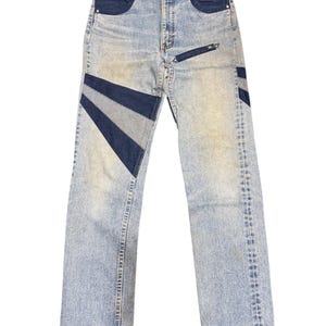 May include: A set of three ceramic mugs with a speckled, matte finish. The mugs are in shades of cream, light gray, and dark gray. Each mug has a simple, minimalist design, perfect for coffee or tea.