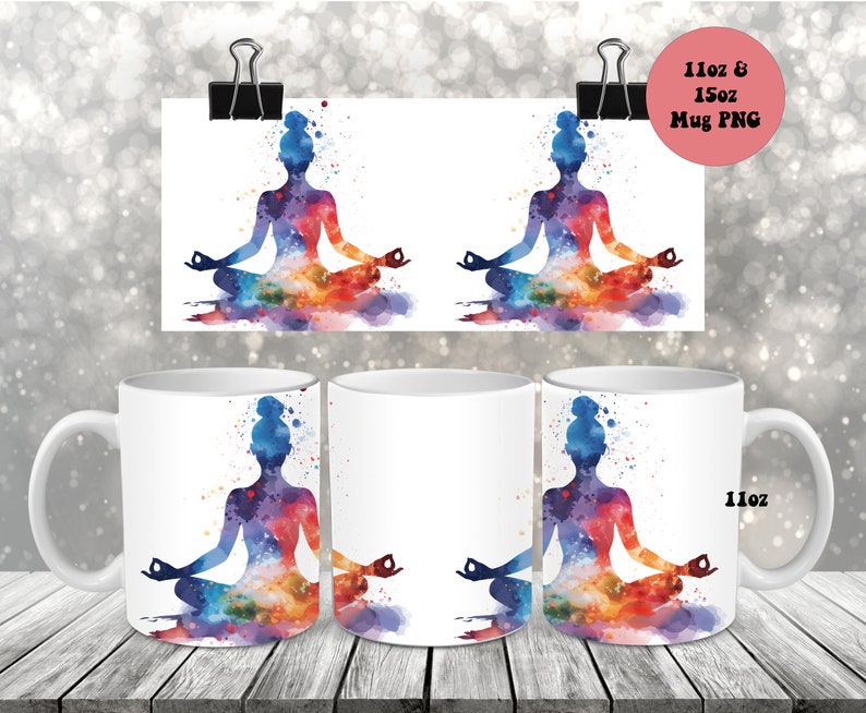 May include: Two white ceramic mugs with a colorful watercolor design of a person in a yoga pose. The design features a silhouette of a person sitting in a lotus position with colorful watercolor splashes around them. The mugs are 11 oz and are available in 15 oz sizes.