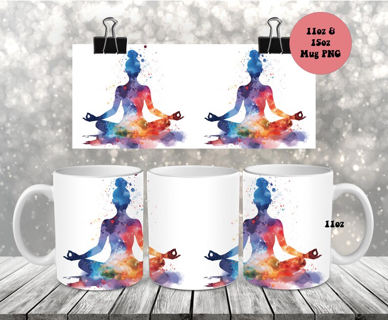 May include: Two white ceramic mugs with a colorful watercolor design of a person in a yoga pose. The design features a silhouette of a person sitting in a lotus position with colorful watercolor splashes around them. The mugs are 11 oz and are available in 15 oz sizes.
