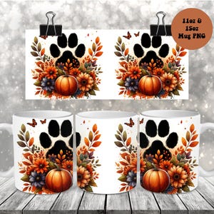 Puede incluir: Tazas de cerámica blanca con un diseño de temática otoñal que presenta una huella de pata negra, calabazas, girasoles y hojas de otoño. El diseño se repite en las tazas y en una tarjeta impresa sujeta con un clip. La imagen también incluye un gráfico circular con texto.