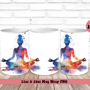 May include: Two white ceramic mugs with a watercolor design of a person in a yoga pose. The design is in shades of blue, purple, orange, and yellow. The mugs are 11 oz and 15 oz.