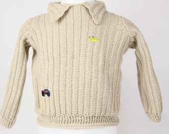 pull gris a col châle pour enfant de 3/4 ans au crochet.