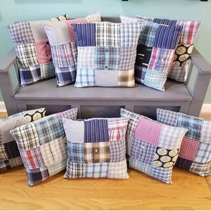 May include: A collection of eight patchwork pillows made from repurposed fabric. The pillows are in various shades of blue, green, red, and white. The pillows are arranged on a gray bench.