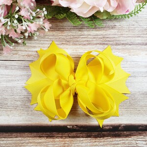 Yellow hair bow for ponytails and pig tails, hairclips for girls and toddler hairstyles, kids accessories designs, boutique alligator clip