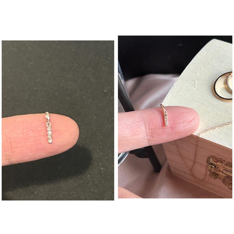 May include: A delicate gold chain with a small diamond pendant. The pendant is a thin bar with five small diamonds set in a row.