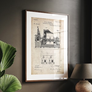 Può includere: Un disegno di brevetto vintage per un generatore elettrico, stampato su carta invecchiata con una cornice marrone. Il brevetto è per T.A. Edison, brevettato il 12 luglio 1882, e numerato 261.501.