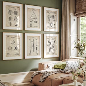 May include: Six framed vintage patent prints of billiard equipment hang on a green wall. The prints, in neutral tones, depict detailed diagrams of pool table components and accessories, adding a touch of classic decor.